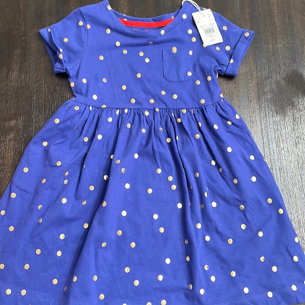 Navy blue dress with gold polka dots. New with tags.